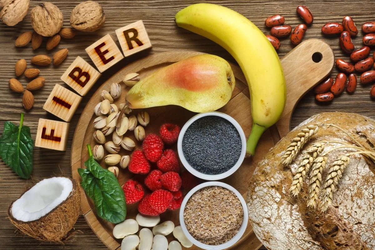 Different Foods on a wooden table as sources of fiber