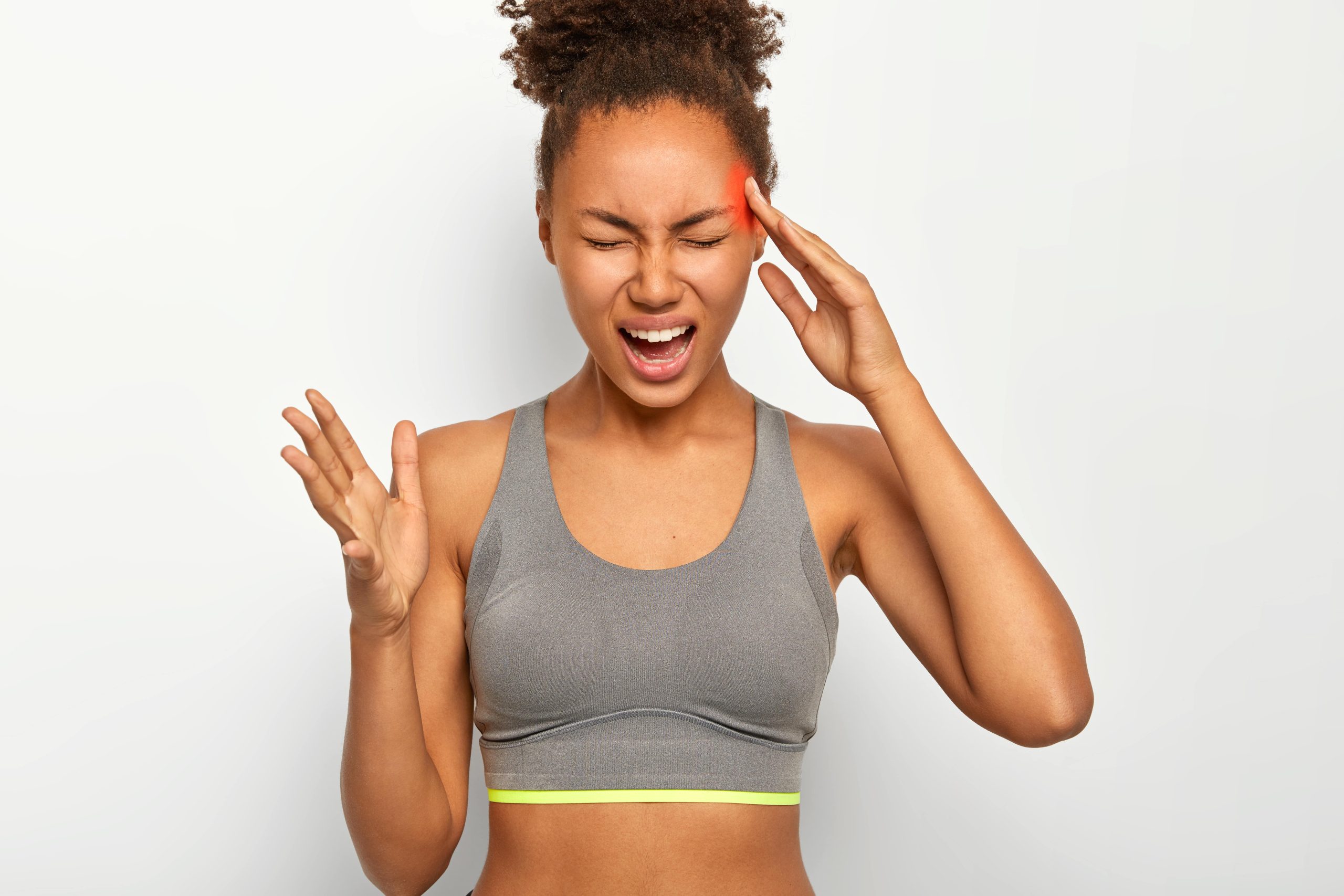 woman with hand on the face because of headache