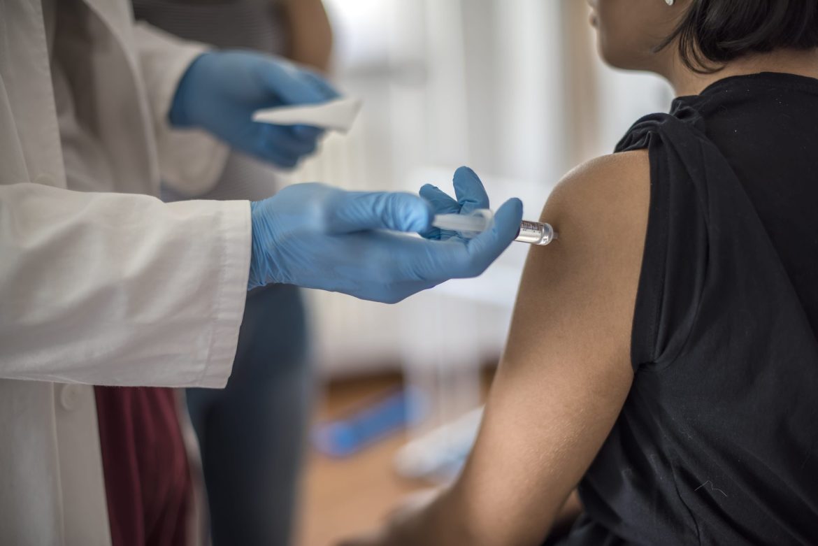 a female patient getting vaccinated