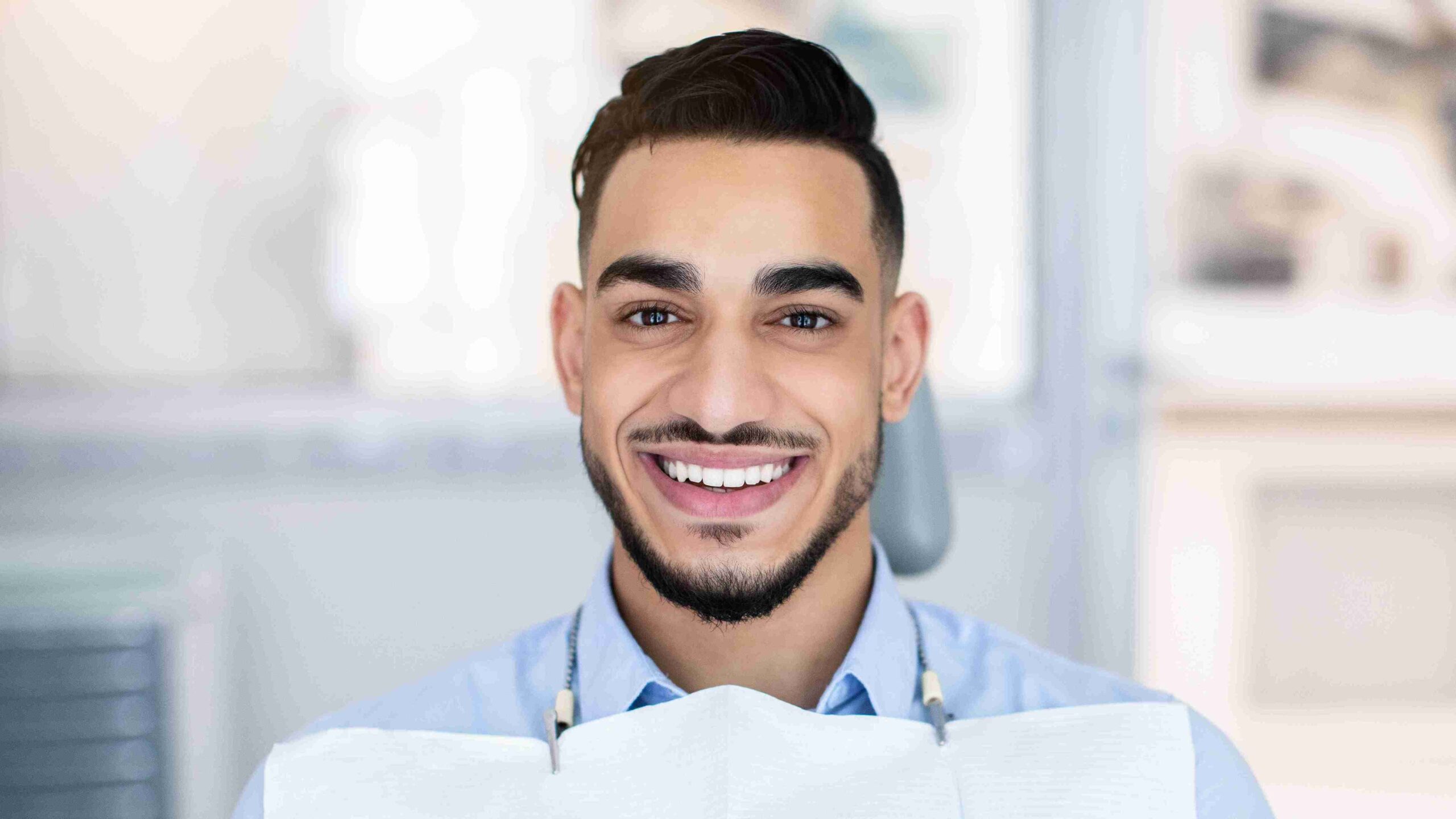 male patient smiling at the camera