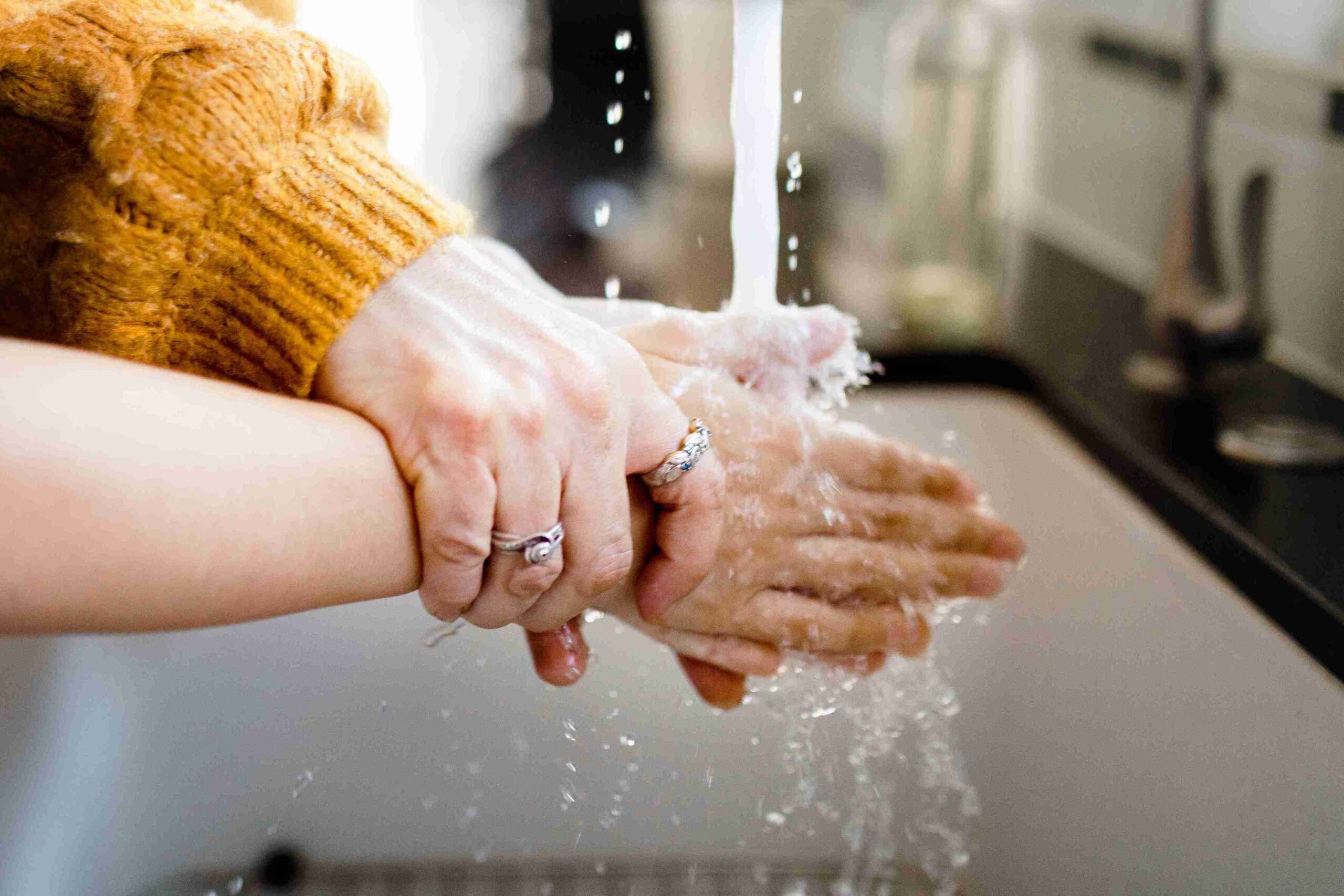 woman and child washing their hands