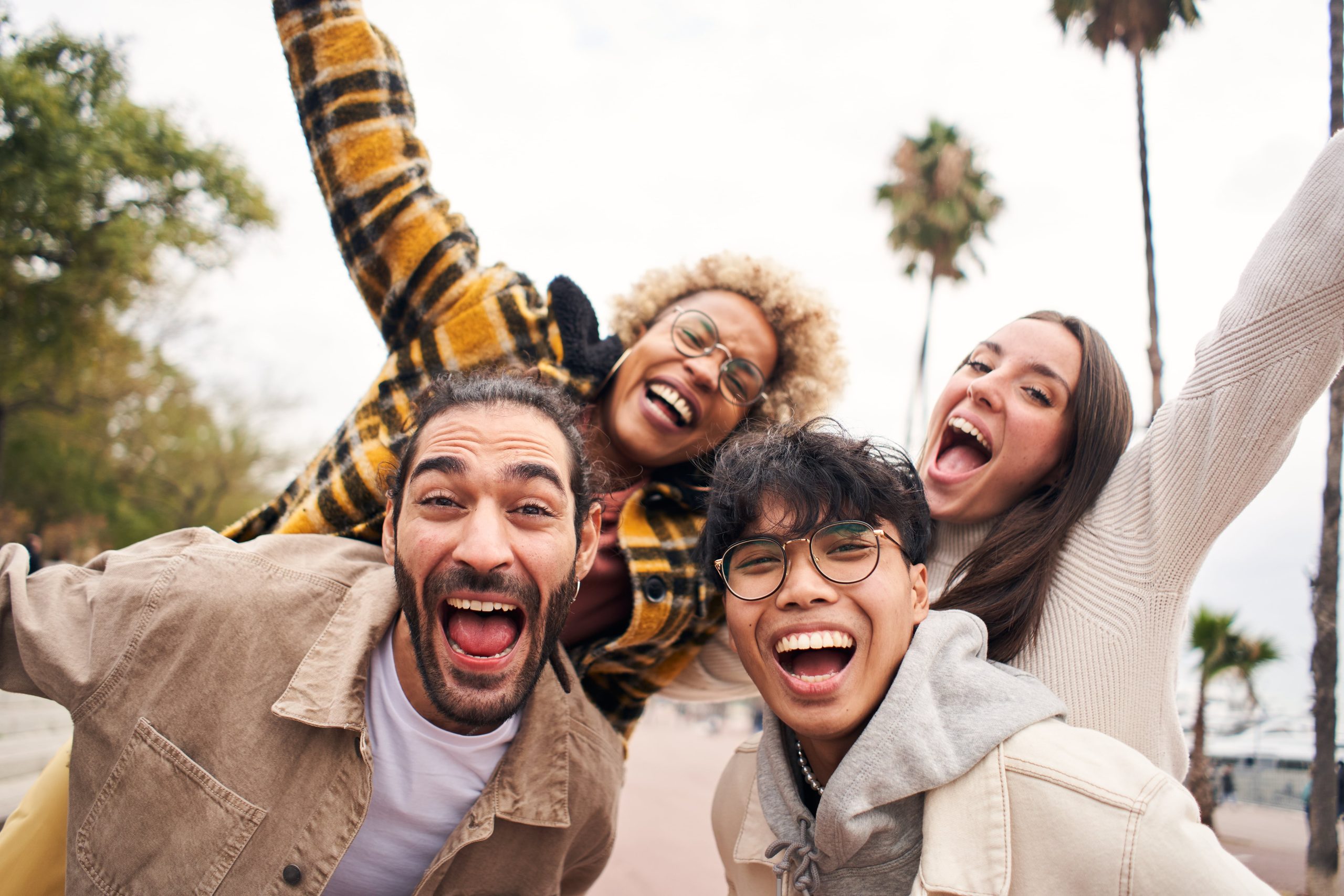four young people smiling