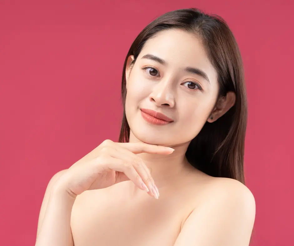 A poised woman with a confident expression, showcasing healthy and well-nourished skin