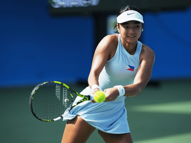 Alexandra Eala hitting a backhand